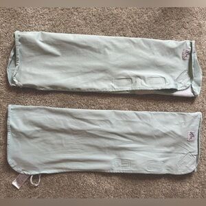 Two light blue Ollie swaddles